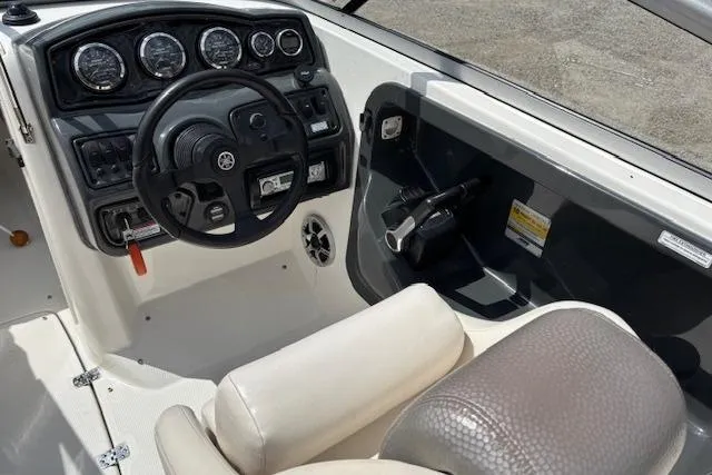 Slide: The Image of 2007 Yamaha AR 230 boat cockpit with steering wheel and control panel. - 6