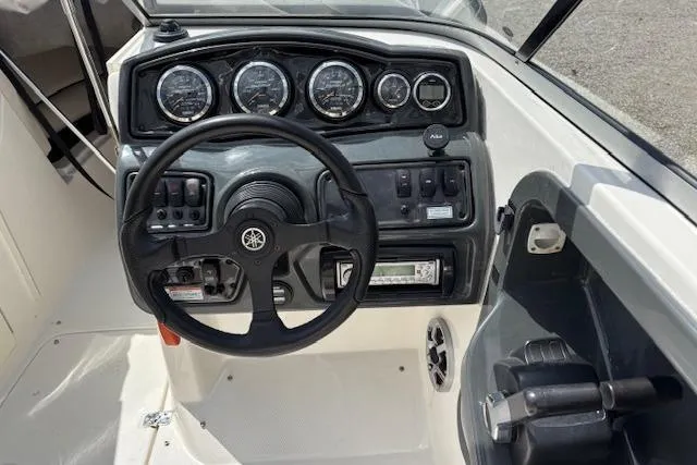 Slide: The Image of 2007 Yamaha AR 230 boat dashboard with steering wheel and instrument panel. - 7