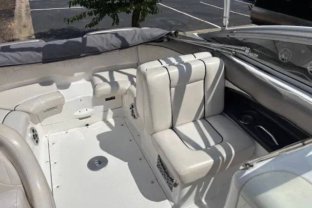 Slide: The Image of 2007 Yamaha AR 230 boat interior with white seating and clean deck. - 9