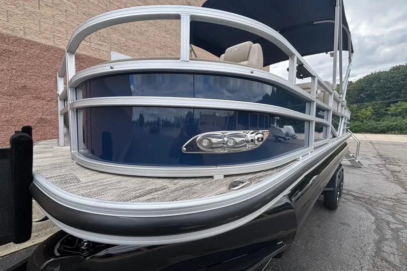 Slide: The Image of 2025 Ranger 220F pontoon boat with sleek blue exterior and modern design. - 10