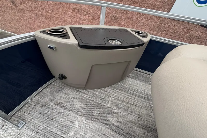 Slide: The Image of Interior of 2025 Ranger 220F boat with seating and storage console. - 5