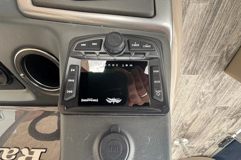 Slide: The Image of Control panel of 2025 Ranger 220F boat with audio system and USB port. - 8