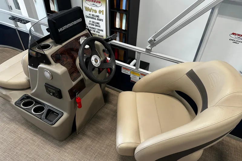 Slide: The Image of 2023 Sun Tracker Bass Buggy 16 XL Select boat interior with steering console and seating. - 6