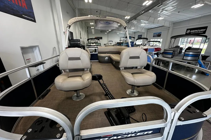 Slide: The Image of 2023 Sun Tracker Bass Buggy 16 XL Select pontoon boat interior in showroom. - 9
