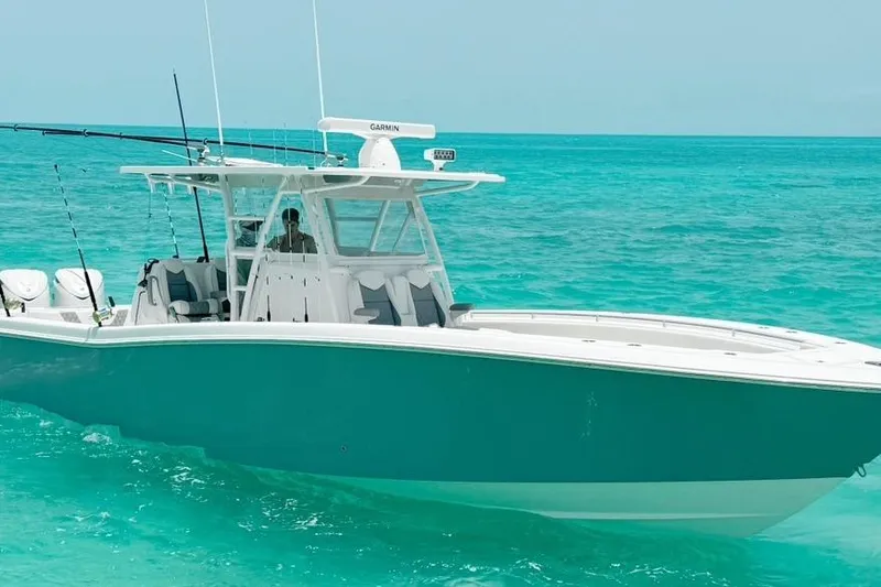 Slide: The Image of 2024 Invincible 39 Open Fisherman boat on turquoise ocean waters. - 1