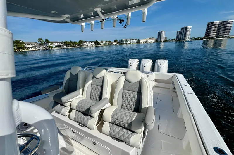 Slide: The Image of 2024 Invincible 39 Open Fisherman boat with luxurious seating on calm waters. - 14