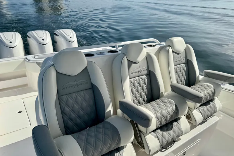 Slide: The Image of 2024 Invincible 39 Open Fisherman boat with luxurious seating and multiple engines. - 7