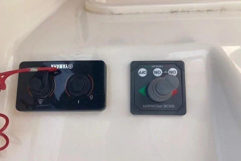 Slide: The Image of Control panel of a 2014 Grady-White Freedom 285 boat with Yamaha and Side-Power controls. - 13