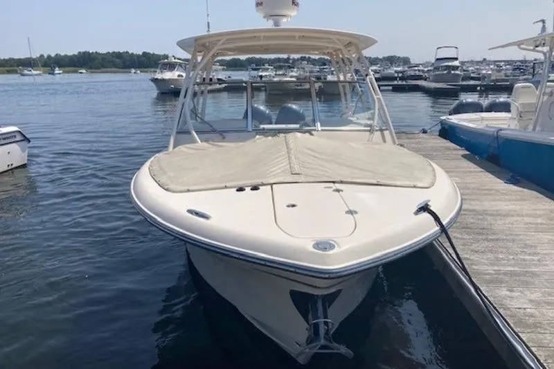 Slide: The Image of 2014 Grady-White Freedom 285 boat docked at marina. - 9