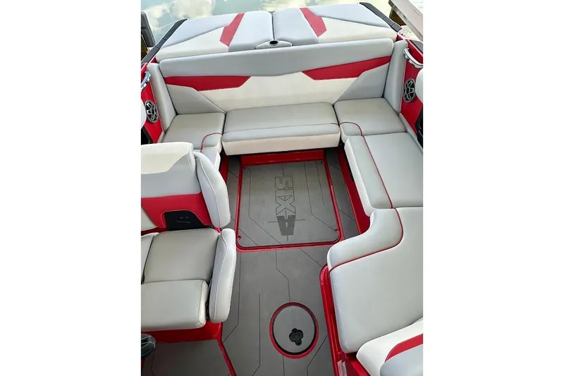 Slide: The Image of 2021 Axis A20 boat interior with red and gray seating, featuring stylish design and spacious layout. - 16
