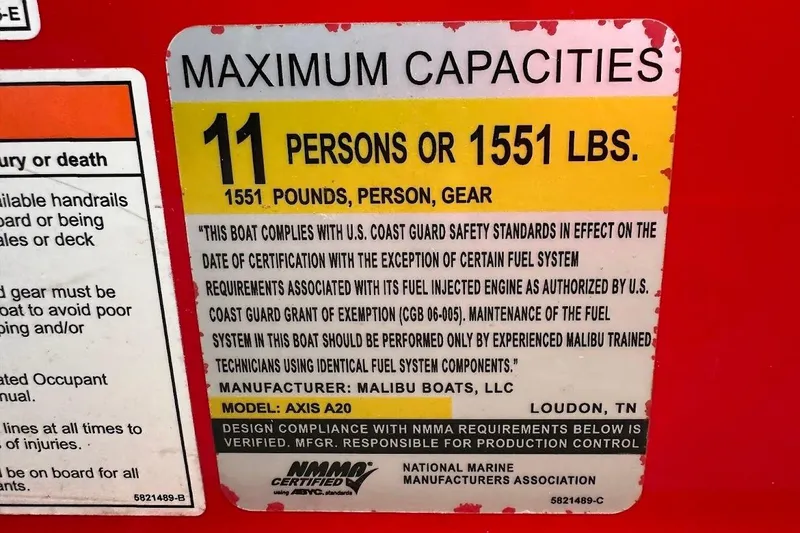 Slide: The Image of 2021 Axis A20 boat capacity label: 11 persons or 1551 lbs, safety compliance details. - 24