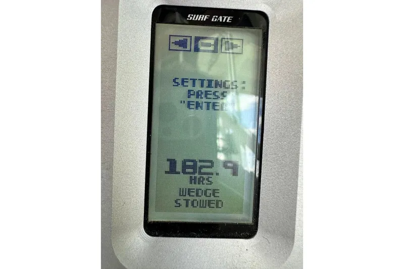 Slide: The Image of Display screen of 2021 Axis A20 boat showing 182.9 hours and settings menu. - 31