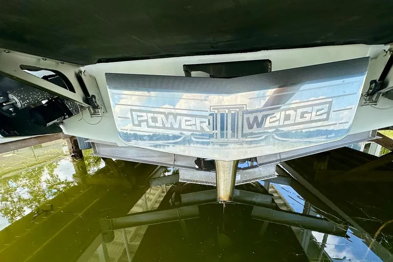 Slide: The Image of 2021 Axis A20 boat with Power Wedge III, reflected in water. - 34