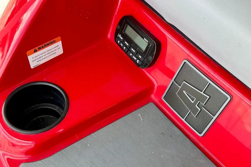 Slide: The Image of Red interior of 2021 Axis A20 boat with cup holder and control panel. - 35