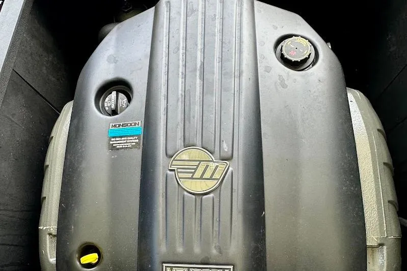 Slide: The Image of 2021 Axis A20 engine cover with Monsoon branding and logo. - 5