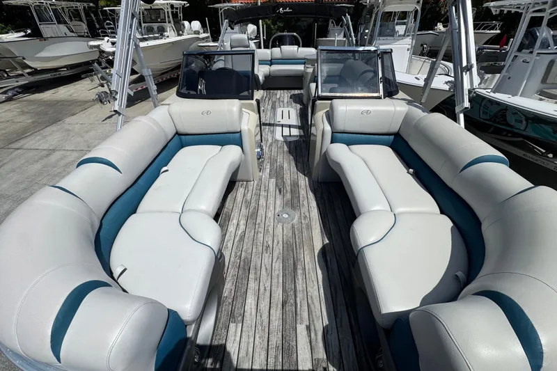 Slide: The Image of 2019 Avalon Catalina Platinum Elite Windshield boat with spacious seating and sleek design. - 13