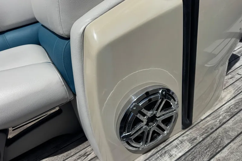 Slide: The Image of 2019 Avalon Catalina Platinum Elite boat interior with speaker and cushioned seating. - 18