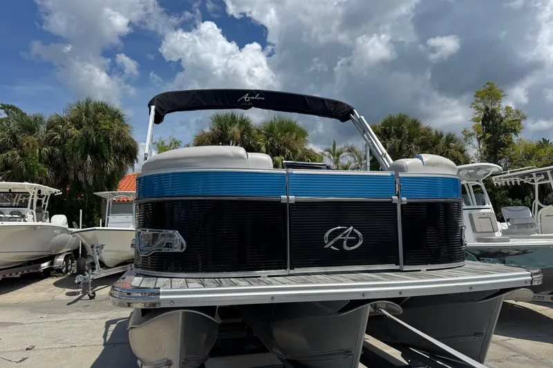 Slide: The Image of 2019 Avalon Catalina Platinum Elite pontoon boat, 25 feet, docked under cloudy sky. - 5