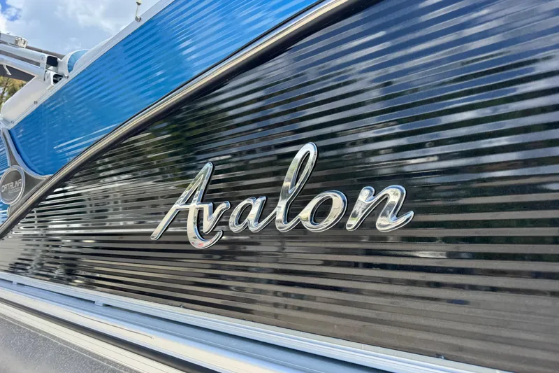 Slide: The Image of 2019 Avalon Catalina Platinum Elite boat with sleek design and logo. - 7