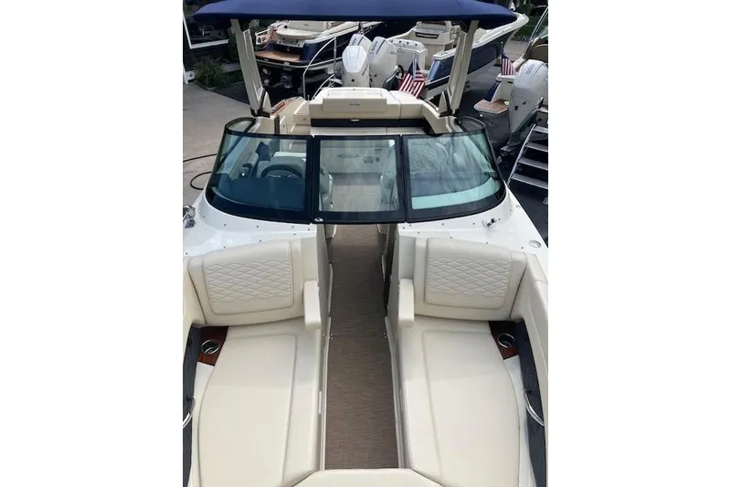 Slide: The Image of 2026 Chris-Craft Sportster 28 boat with luxurious seating and sleek design. - 23