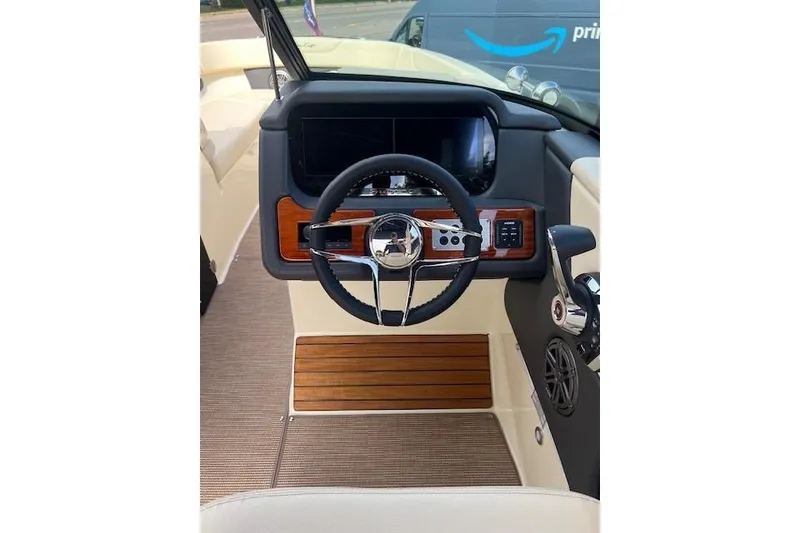 Slide: The Image of 2026 Chris-Craft Sportster 28 dashboard with steering wheel and control panel. - 7