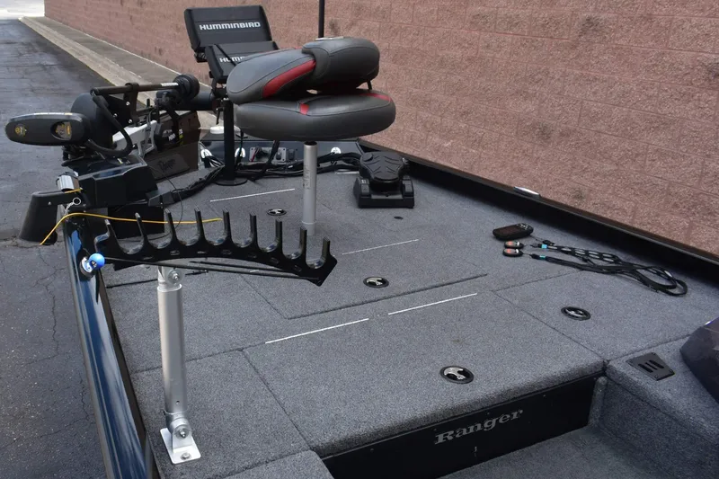 Slide: The Image of 2021 Ranger RT188C boat interior with fishing equipment and seating. - 3