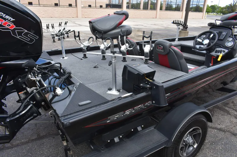Slide: The Image of 2021 Ranger RT188C fishing boat with Mercury Pro XS engine, rod holders, and seating. - 5