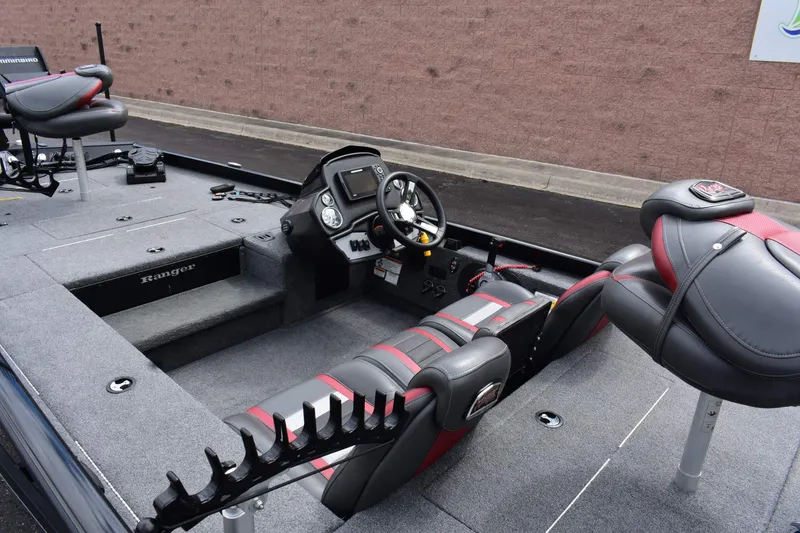 Slide: The Image of 2021 Ranger RT188C boat interior with steering console and seating. - 8