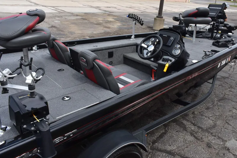 Slide: The Image of 2021 Ranger RT188C fishing boat interior with steering console and seating. - 9