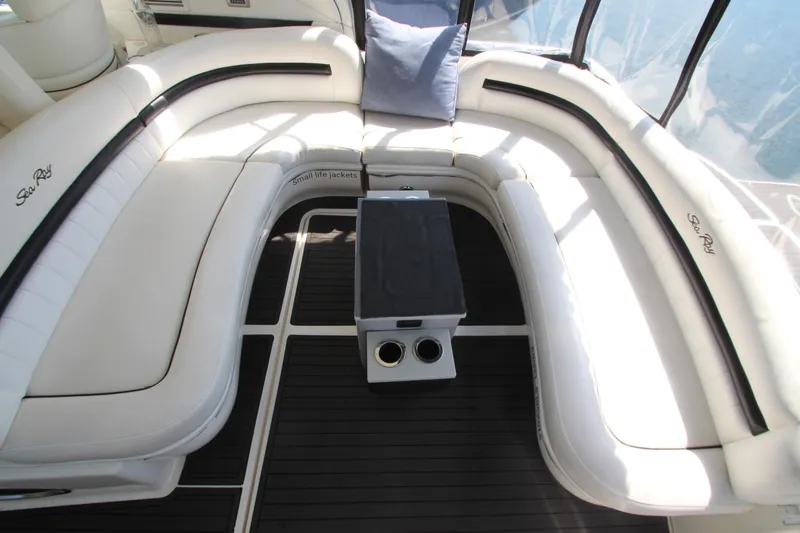 Slide: The Image of Luxurious seating area on 2008 Sea Ray 44 Sundancer yacht with white cushions and table. - 10