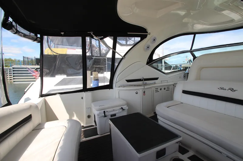 Slide: The Image of Interior of 2008 Sea Ray 44 Sundancer yacht with white seating and sleek design. - 12