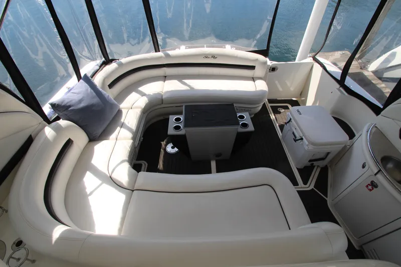 Slide: The Image of Luxurious 2008 Sea Ray 44 Sundancer yacht interior with plush seating and table. - 16