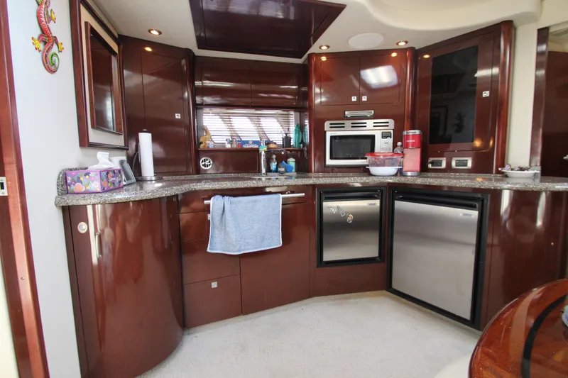 Slide: The Image of Luxurious kitchen interior of 2008 Sea Ray 44 Sundancer yacht with modern appliances. - 23