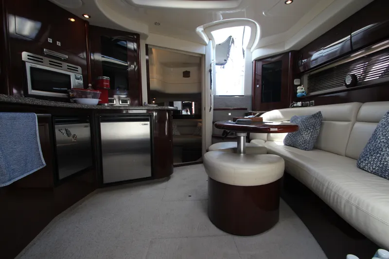 Slide: The Image of Luxurious interior of 2008 Sea Ray 44 Sundancer yacht with modern kitchen and seating area. - 25