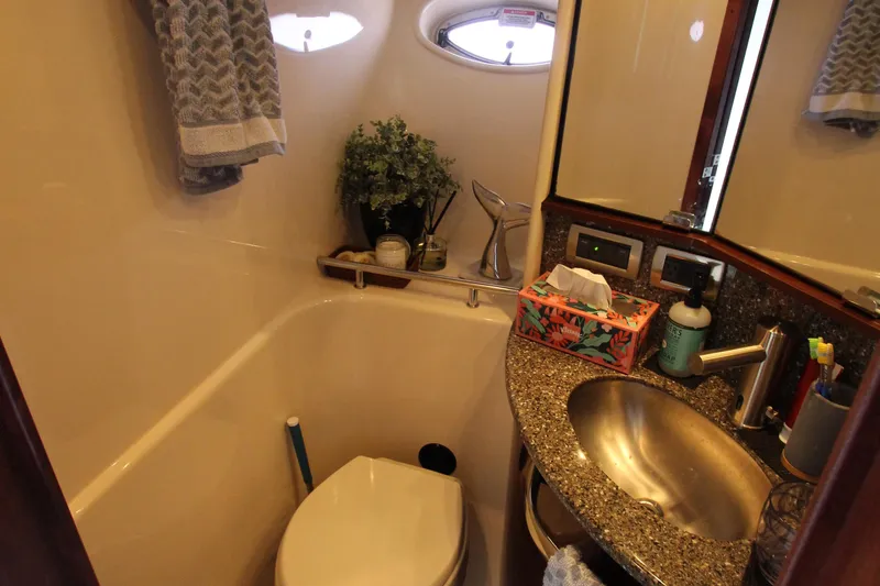 Slide: The Image of Luxurious 2008 Sea Ray 44 Sundancer bathroom with modern amenities and elegant design. - 29