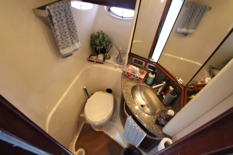Slide: The Image of 2008 Sea Ray 44 Sundancer bathroom with sink, toilet, and mirror. - 31