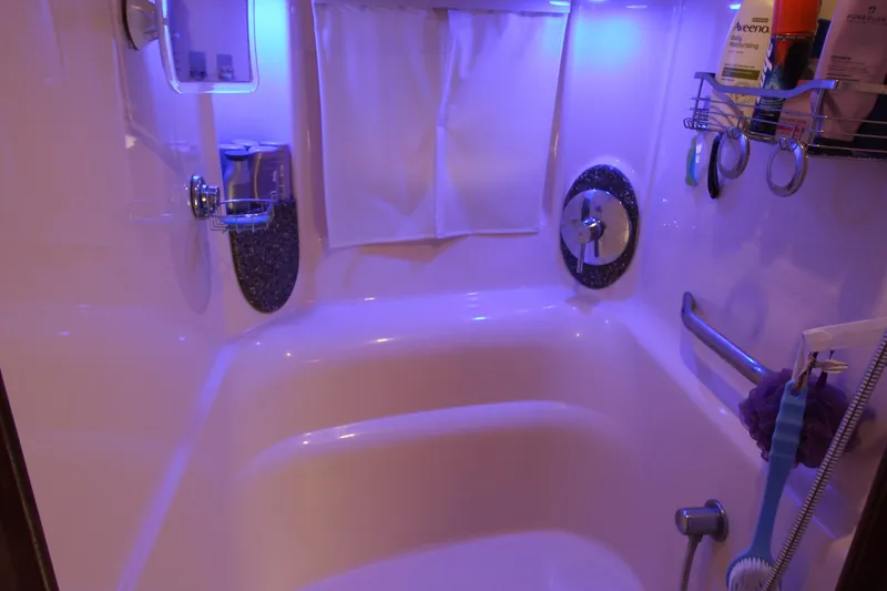 Slide: The Image of Luxurious bathroom in 2008 Sea Ray 44 Sundancer yacht with blue ambient lighting. - 32