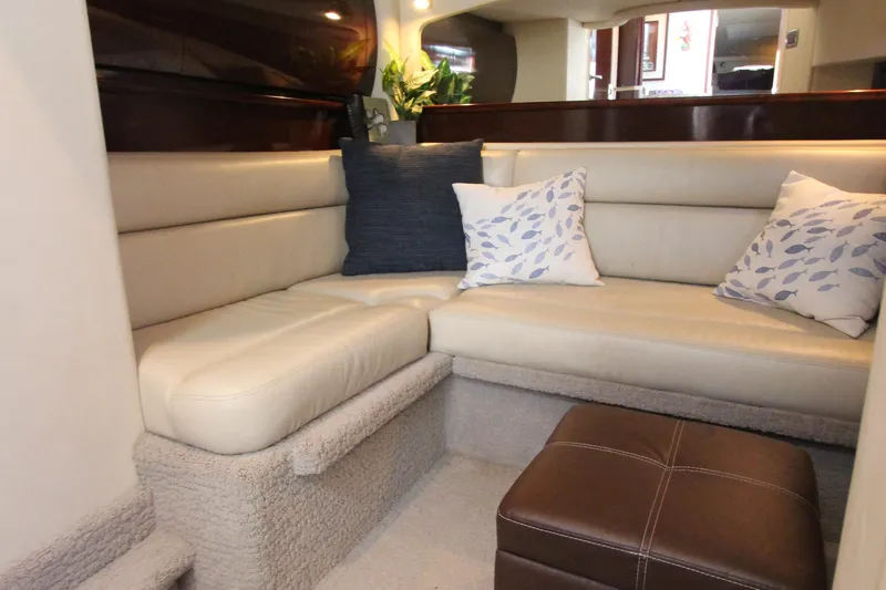 Slide: The Image of Luxurious interior of 2008 Sea Ray 44 Sundancer with plush seating and decorative pillows. - 37