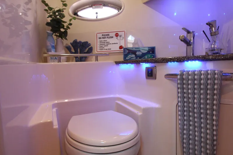 Slide: The Image of Luxurious bathroom in 2008 Sea Ray 44 Sundancer yacht with modern fixtures and ambient lighting. - 42
