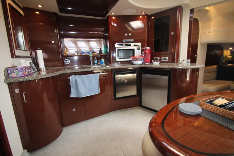 Slide: The Image of Luxurious kitchen interior of 2008 Sea Ray 44 Sundancer yacht with modern appliances. - 46