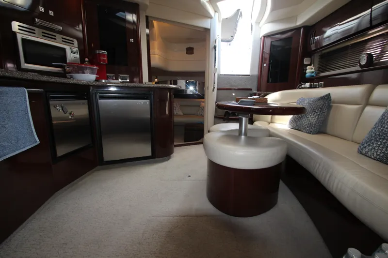 Slide: The Image of Luxurious interior of 2008 Sea Ray 44 Sundancer yacht with modern kitchen and seating area. - 48