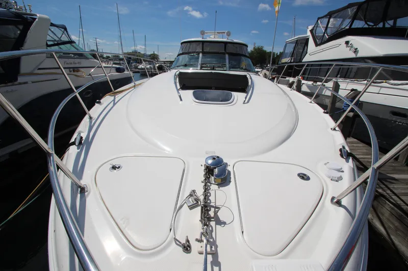 Slide: The Image of 2008 Sea Ray 44 Sundancer yacht docked, showcasing sleek deck design and modern features. - 5