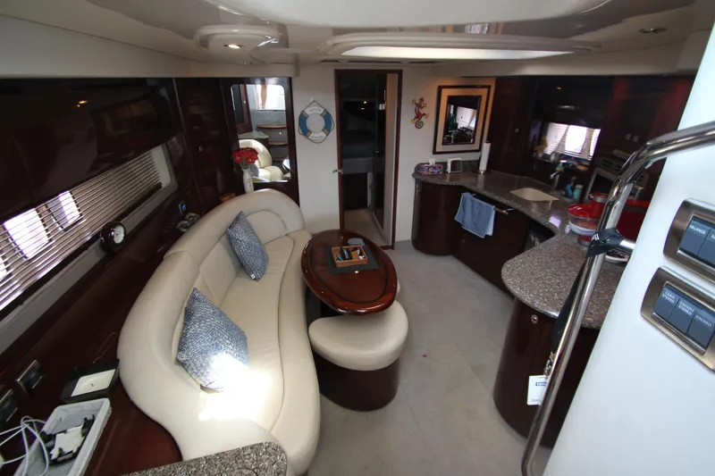 Slide: The Image of Luxurious interior of 2008 Sea Ray 44 Sundancer yacht with elegant seating and modern kitchen. - 50