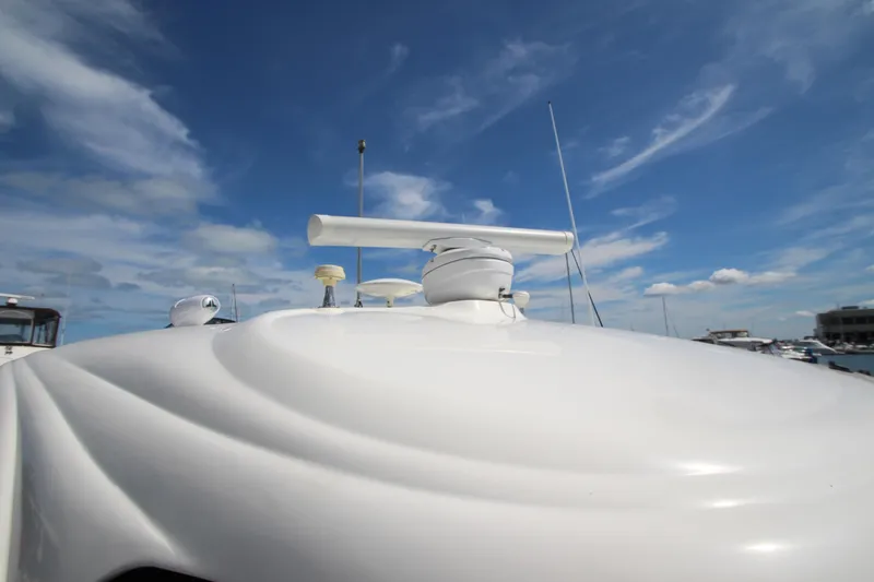 Slide: The Image of 2008 Sea Ray 44 Sundancer radar equipment under a clear blue sky. - 53