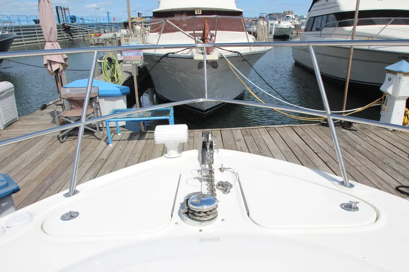 Slide: The Image of Bow view of 2008 Sea Ray 44 Sundancer docked at marina. - 55