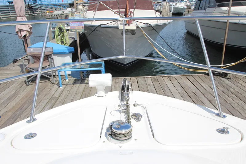 Slide: The Image of Bow view of 2008 Sea Ray 44 Sundancer docked at marina. - 56