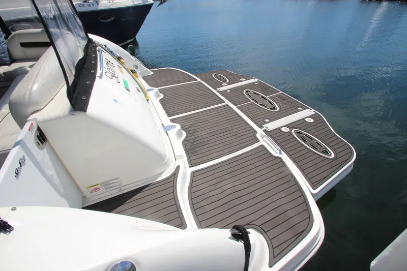 Slide: The Image of 2008 Sea Ray 44 Sundancer swim platform with sleek design on calm water. - 59