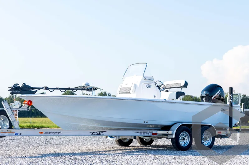 The Image of 2026 Tidewater 2110 Bay Max boat on trailer, side view, outdoors. - 1