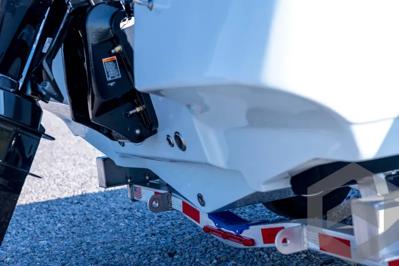 Slide: The Image of 2026 Tidewater 2110 Bay Max boat on trailer, close-up view. - 18
