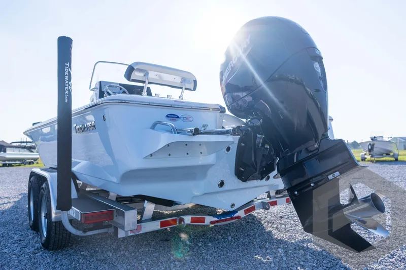 Slide: The Image of 2026 Tidewater 2110 Bay Max boat on trailer, featuring powerful outboard motor. - 22